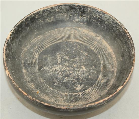 A Greek blackware rouletted bowl, Apulia c 4th century B.C., 17.5cm